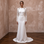 White satin sheath wedding dress with long sleeves and lace cutout bodice