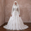 White ball gown wedding dress with long sleeves, embroidered panels, tiered skirt and headscarf