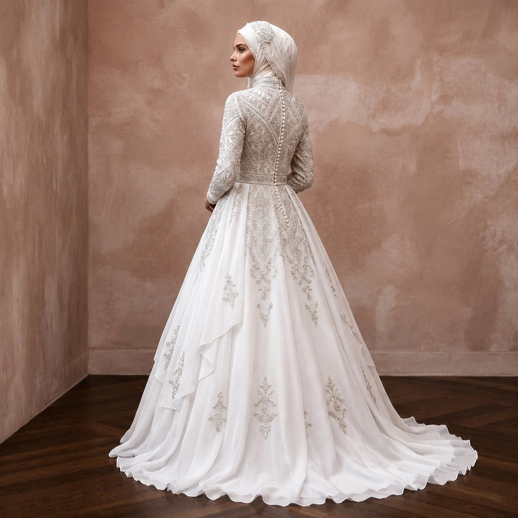 White chiffon wedding dress with long sleeves, embroidered bodice, full ball gown skirt