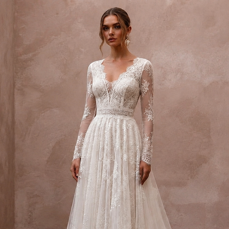 Ivory lace long-sleeve wedding dress with fitted bodice and A-line skirt