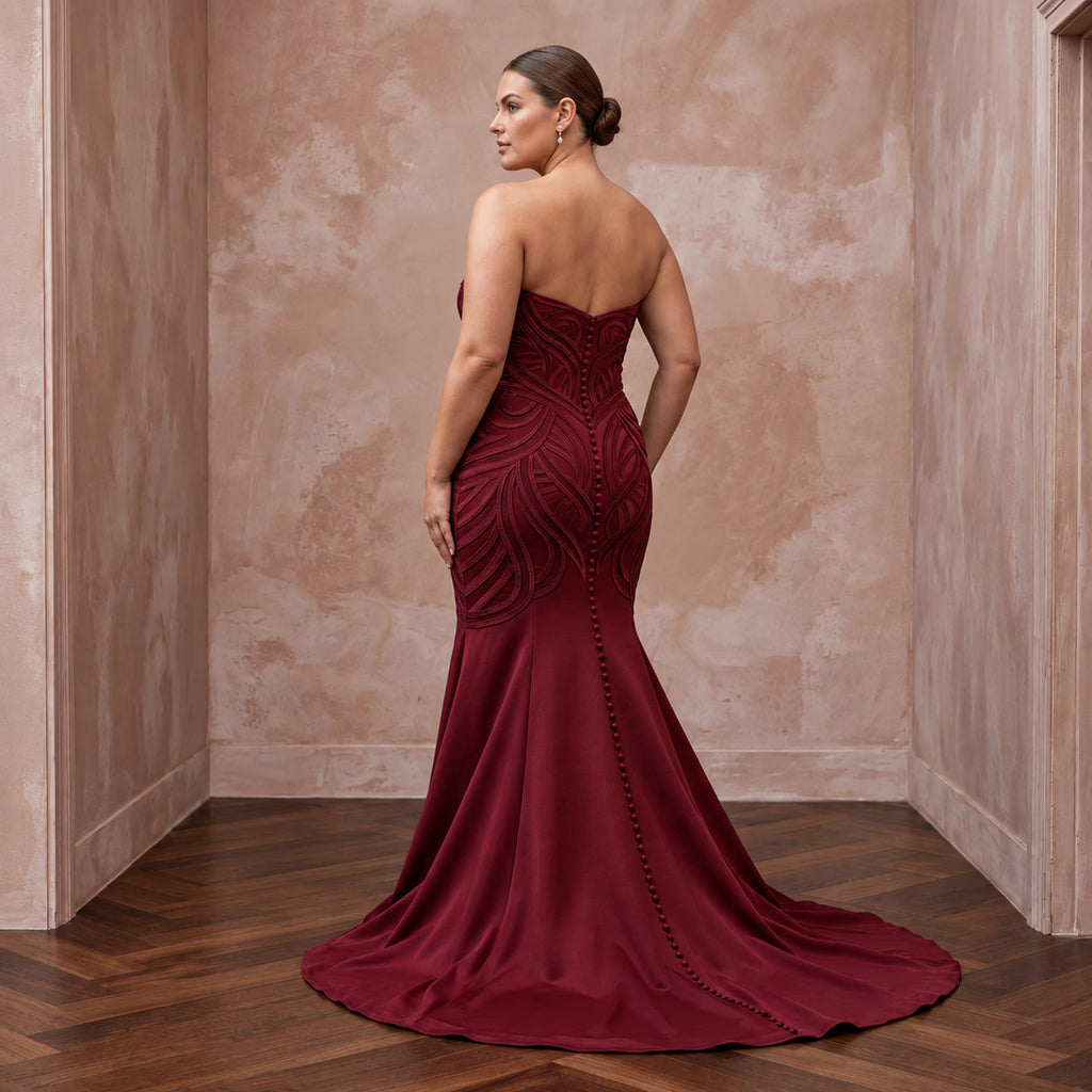 Plus size burgundy heavy matte satin sweetheart mermaid dress with intricate detailing and a flowing train.