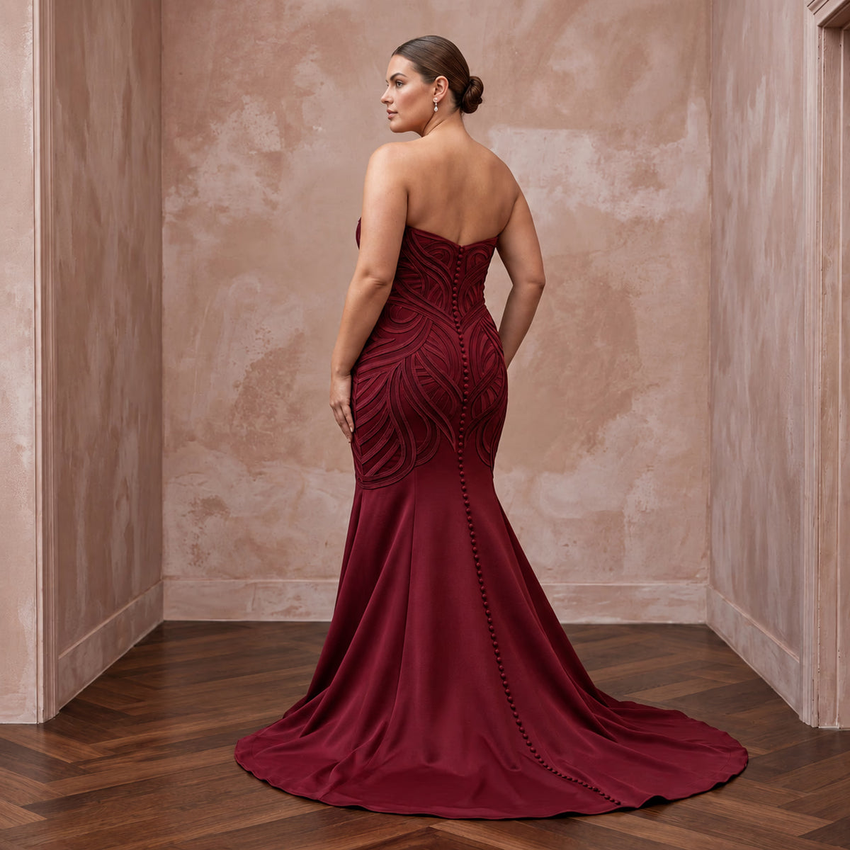 Plus size burgundy heavy matte satin sweetheart mermaid dress with intricate detailing and a flowing train.