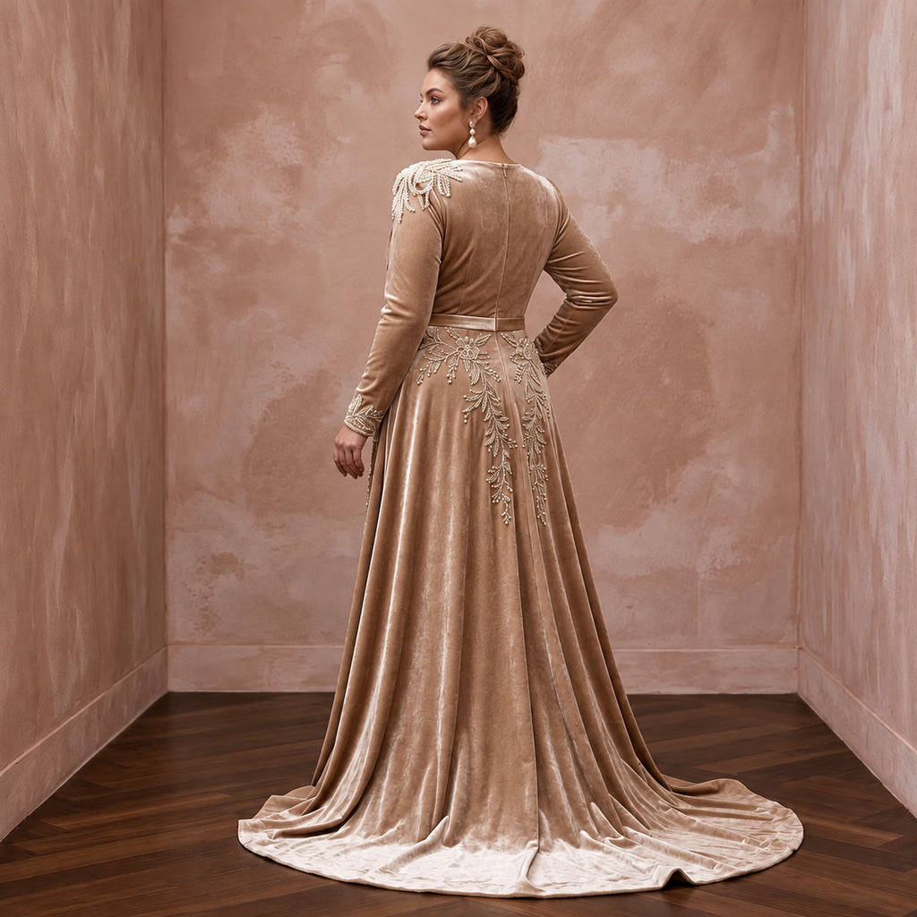 Plus size champagne heavy velvet bridal gown with draped bodice and elegant floral embroidery. Perfect for winter weddings.