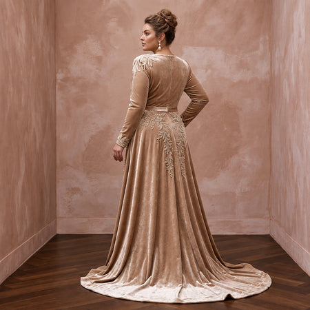 Plus size champagne heavy velvet bridal gown with draped bodice and elegant floral embroidery. Perfect for winter weddings.