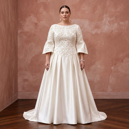 Plus size ivory duchess satin drop waist dress with embroidered bodice and bell sleeves, perfect for grandmillennial style.