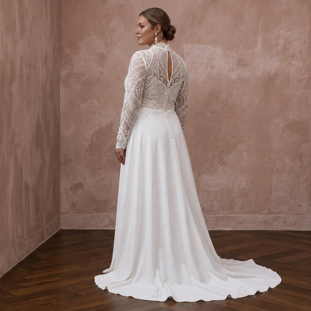 White A-line wedding dress with lace long sleeves, high neckline, and open back