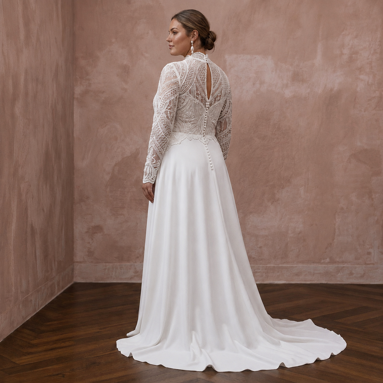 White A-line wedding dress with lace long sleeves, high neckline, and open back