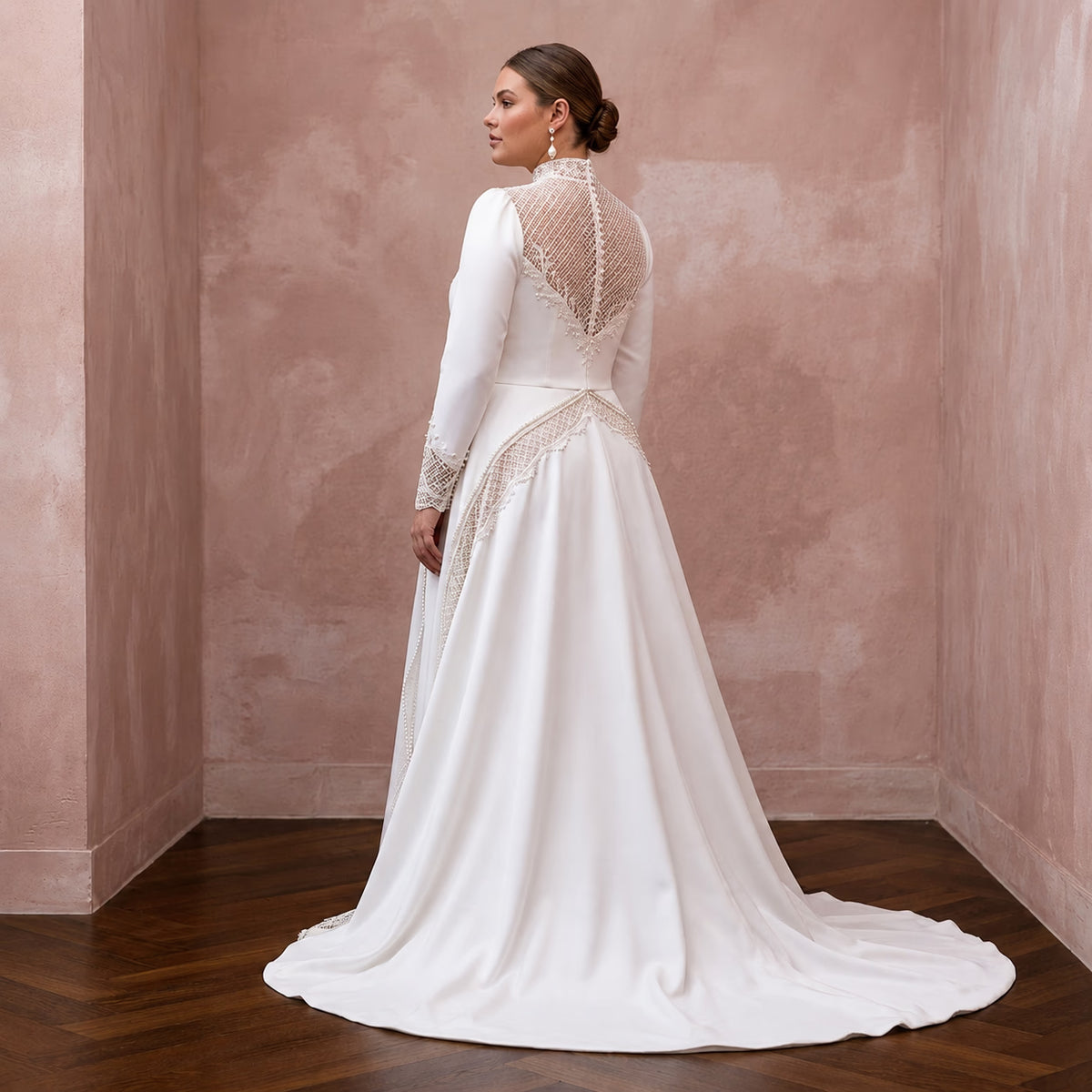 White satin modest wedding dress with lace long sleeves and flowing A-line skirt