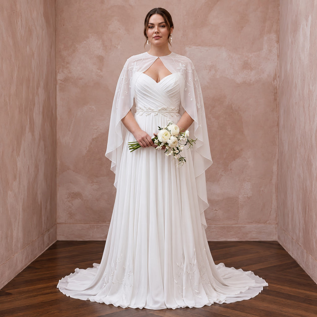 Plus size silk chiffon draped capelet bridal gown in pure white, featuring a flowy skirt and elegant detailing.