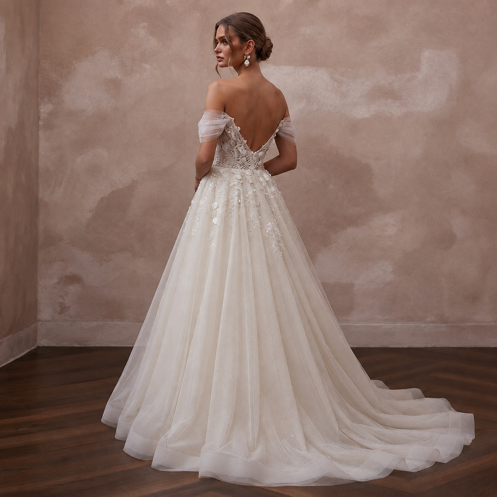 Ivory off-shoulder tulle ball gown wedding dress with lace appliques and full skirt