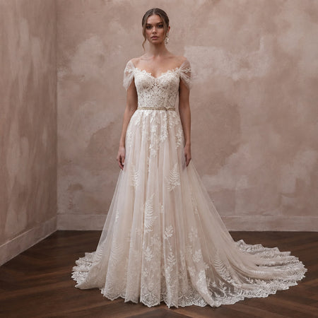 Romantic Lace Bridal Dress with Chapel Train for a Forest Wedding