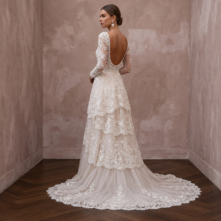 Romantic Lace Bridal Dress with Floral Motifs for an Outdoor Ceremony