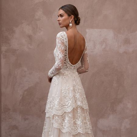 Romantic Lace Bridal Dress with Floral Motifs for an Outdoor Ceremony