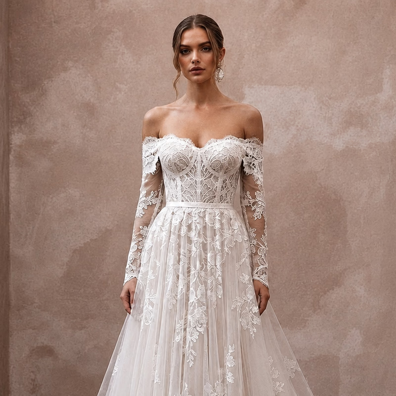 White off-shoulder lace wedding dress with sheer sleeves, fitted waist, and A-line skirt