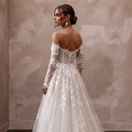 White lace A-line wedding dress with off-shoulder neckline, sheer sleeves, and lace back