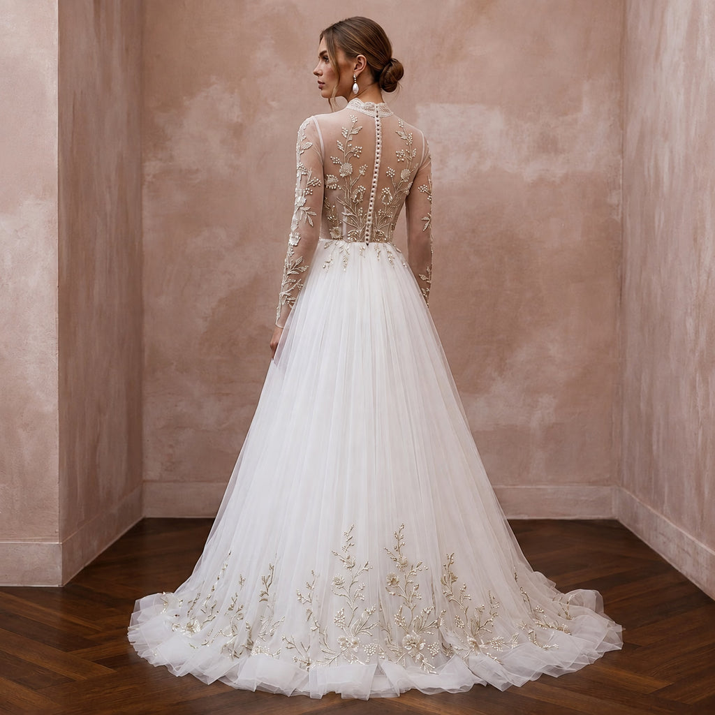 Ivory tulle A-line wedding dress with long sleeves, high back, and floral hem embroidery