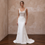 Elegant scoop neck lace wedding dress featuring intricate beading, perfect for a vintage ceremony.