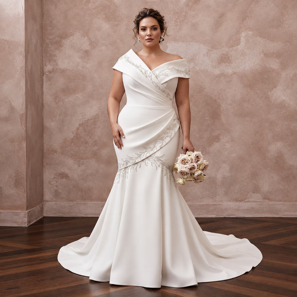Elegant off-white heavy crepe mermaid dress with asymmetrical neckline and intricate beading details. Perfect for weddings.