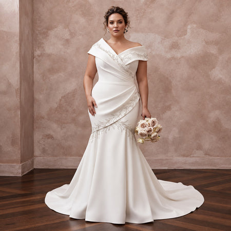 Elegant off-white heavy crepe mermaid dress with asymmetrical neckline and intricate beading details. Perfect for weddings.