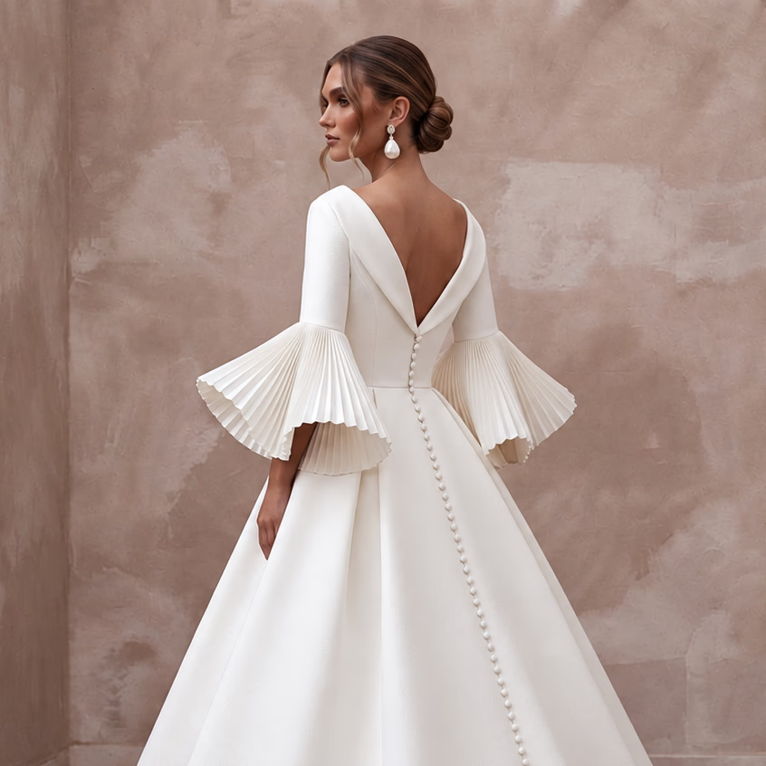 Sculptural White Faille Bell Sleeve Bridal Gown for Museum Reception