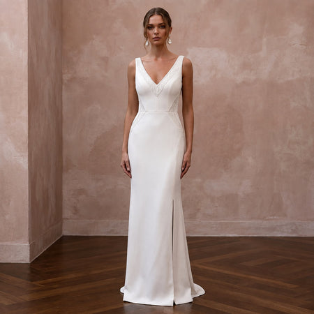 White V-neck crepe sheath wedding dress with sleeveless bodice and floor-length skirt