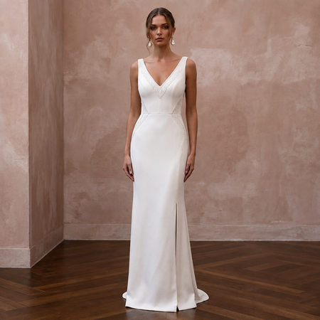 White V-neck crepe sheath wedding dress with sleeveless bodice and floor-length skirt