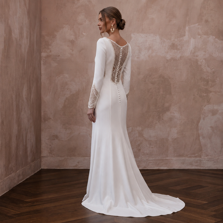 Crepe wedding dress with long sleeves and lace back, floor-length train