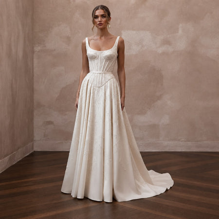 Sophisticated Wedding Dresses with Sculpted Corset Waists - Apparel & Accessories > Clothing > Wedding & Bridal Party Dresses > Wedding Dresses - Mignonette
