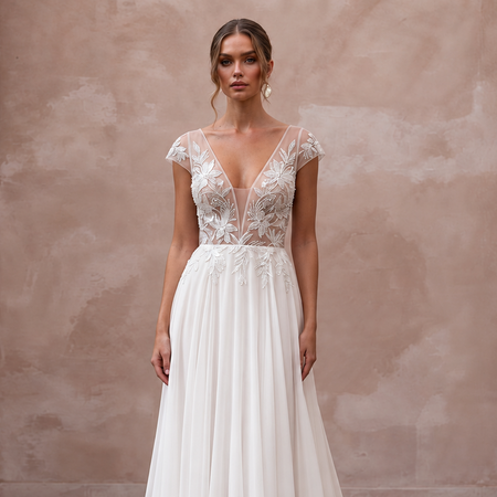 Elegant chiffon bridal dress with embroidered floral bodice and sweep train, perfect for a tropical wedding.