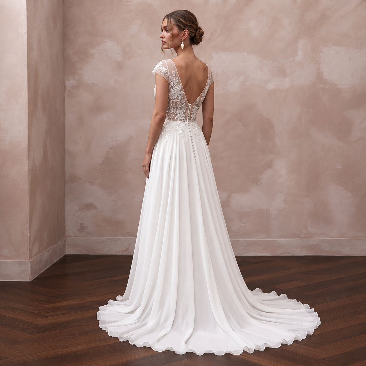 Elegant chiffon bridal dress with bead-embroidered back and sweep train, perfect for a tropical wedding.
