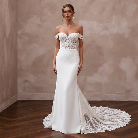 Sweetheart lace wedding gown with off-shoulder sleeves and detachable train, perfect for elegant bridal looks.