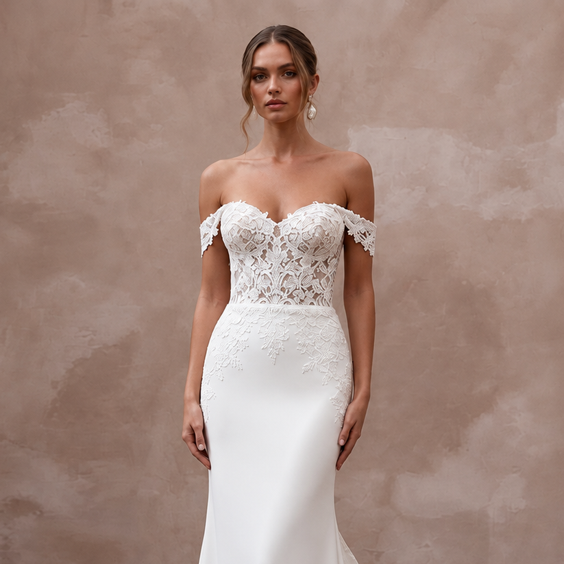 Off-the-shoulder sweetheart lace wedding gown with detachable train and intricate floral details.