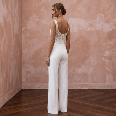 Elegant white stretch crepe jumpsuit with square neck and beaded back, perfect for courthouse weddings.