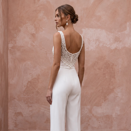 White stretch crepe jumpsuit with square neck and embellished back, perfect for a courthouse wedding.